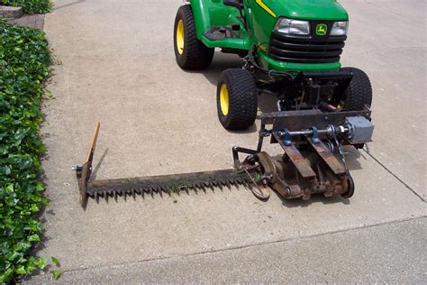 sickle bar mounted to bucket